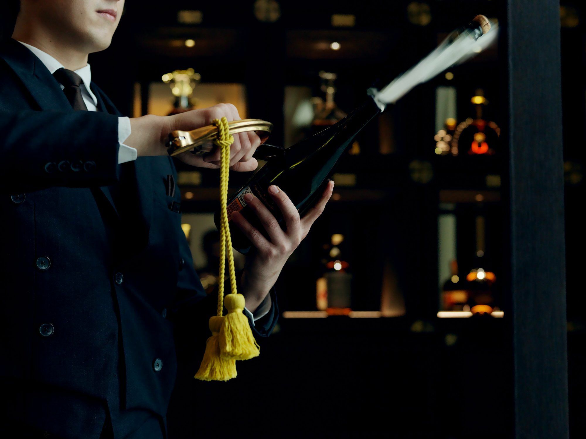The St. Regis Astana Hotel Luaran gambar A wine waiter opening a bottle of wine